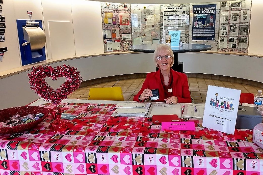 woman stamping valentines